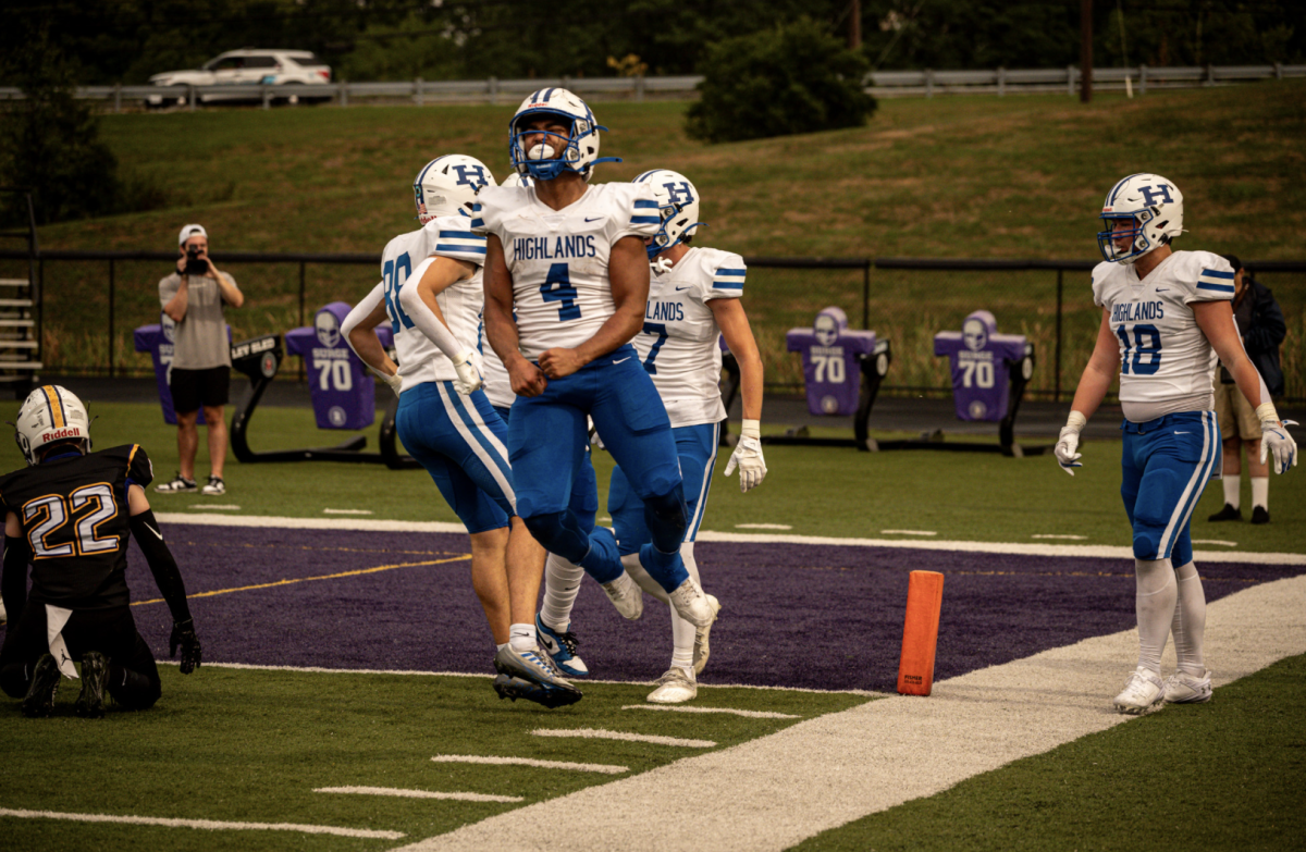 Devon James (12) celebrates after scoring a touchdown. 